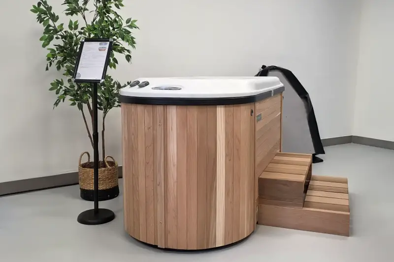Nordic Hottub Bella with red cedar finish and steps in showroom