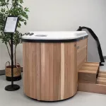 Nordic Hottub Bella with red cedar finish and steps in showroom