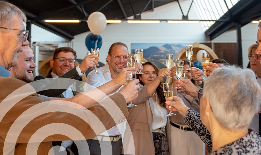 Ticra staff toasting during the festive opening of Ticra Outdoor Maastricht.